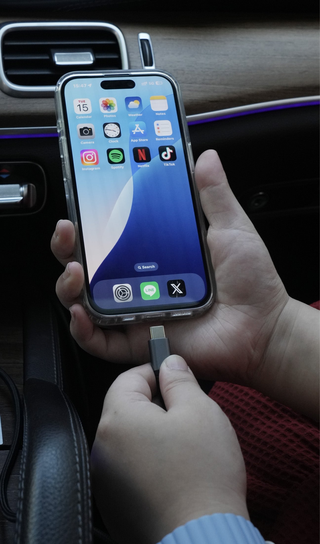 iPhone connecting to car with cable before using Ottocast wireless CarPlay adapter for seamless driving