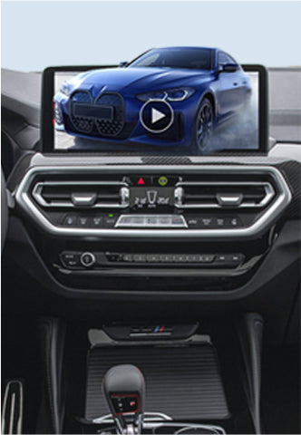 Car dashboard screen playing video of blue BMW using Ottocast wireless CarPlay adapter for in-car entertainment
